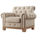 Fauteuil d'appoint capitonné à accoudoirs volutes et clous de tapissier