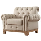 Fauteuil d'appoint capitonné à accoudoirs volutes et clous de tapissier